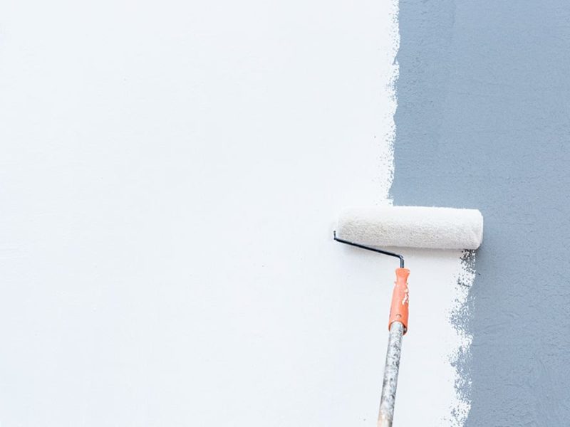 Roller Brush Painting, Worker painting on steel surface wall by the roller brush for protection and corrosion.